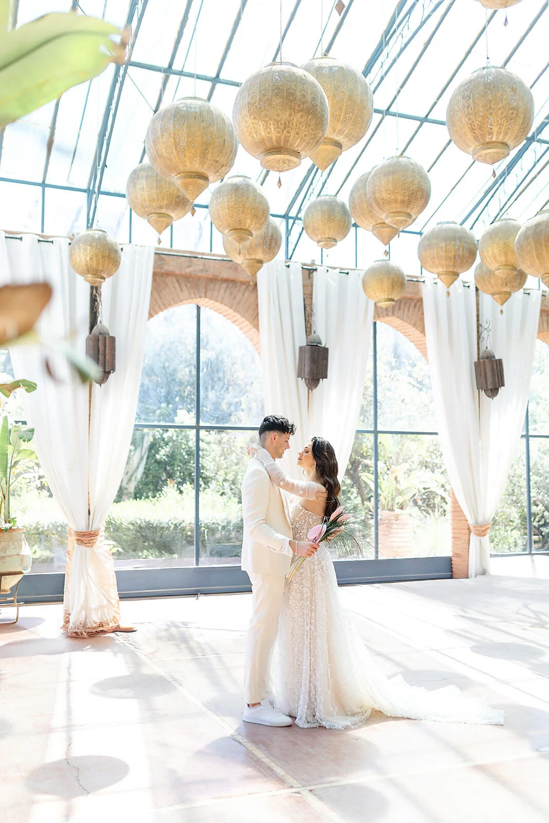 Bride and groom at a luxury wedding in Marrakech with elegant bridal hairstyle