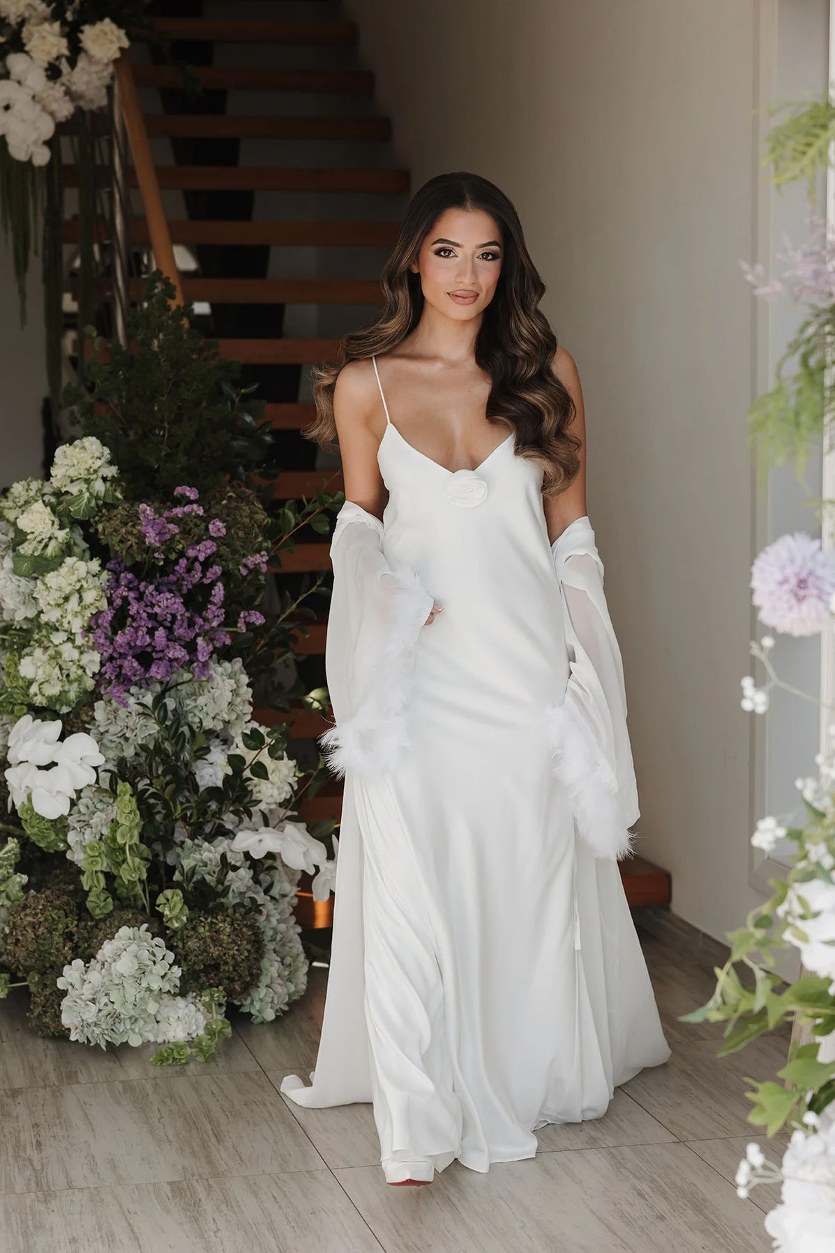 Travel bridal hairstylist preparing foreign bride inside Marrakech riad